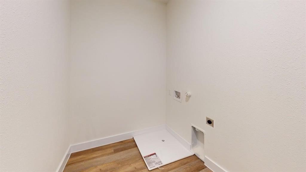 353 Buck Ridge Drive Little Elm, TX 75068 - Photo 20 of 23 Laundry area featuring gas dryer hookup, light wood-type flooring, hookup for a washing machine, and hookup for an electric dryer