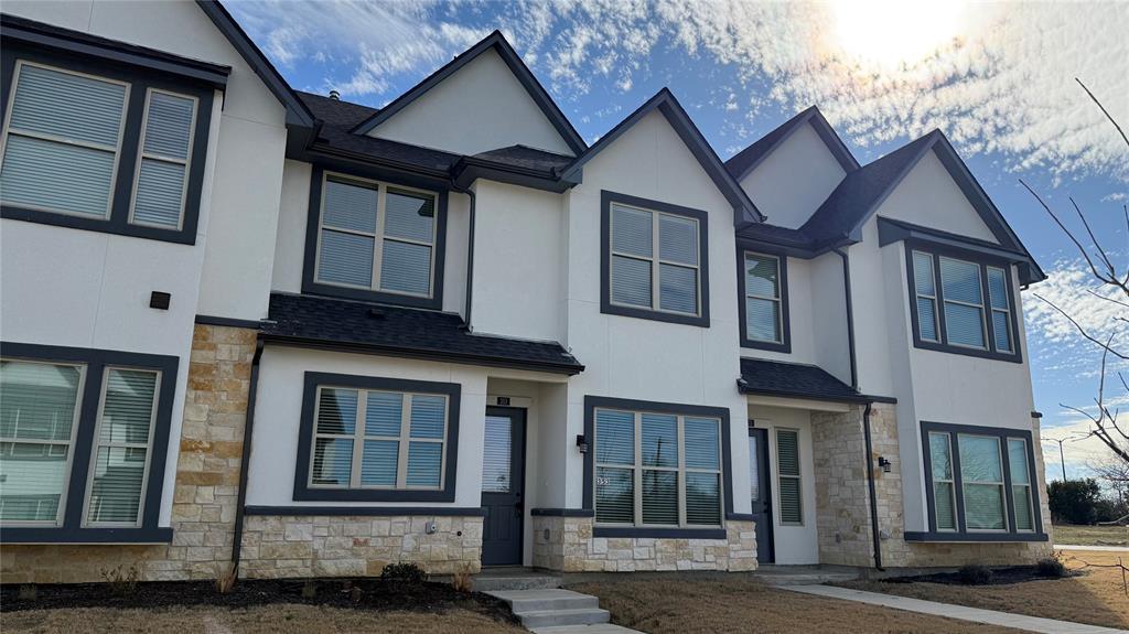 353 Buck Ridge Drive Little Elm, TX 75068 - Photo 2 of 23 View of front of home with stone siding, stucco siding, and roof with shingles