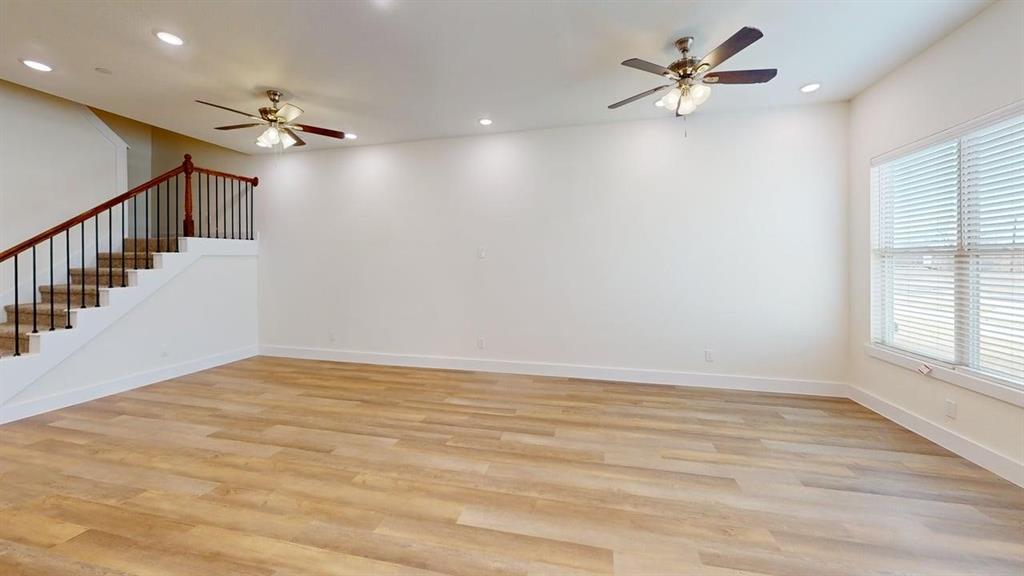 353 Buck Ridge Drive Little Elm, TX 75068 - Photo 6 of 23 Unfurnished living room featuring a ceiling fan, light wood-type flooring, and recessed lighting