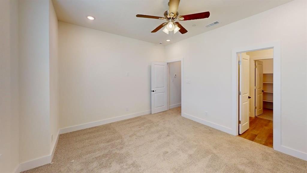 353 Buck Ridge Drive Little Elm, TX 75068 - Photo 10 of 23 Unfurnished bedroom featuring light carpet, a ceiling fan, and recessed lighting