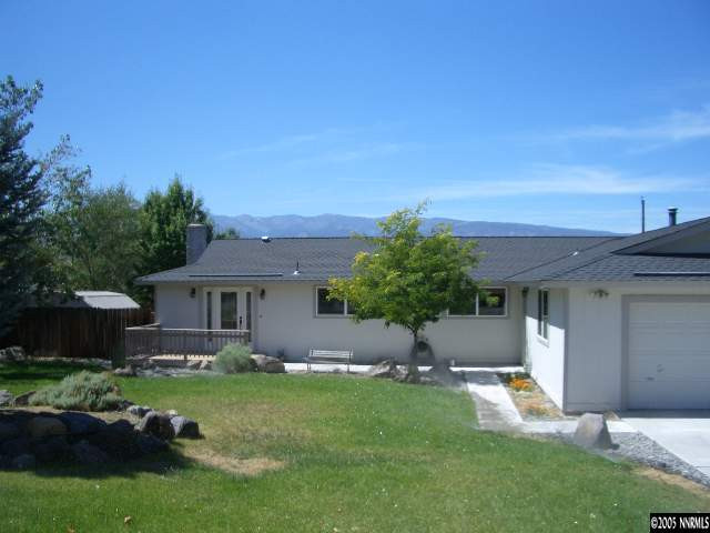 13905 Chamy Drive Reno, NV 89521 - Photo 1 of 9 a front view of a house with a yard