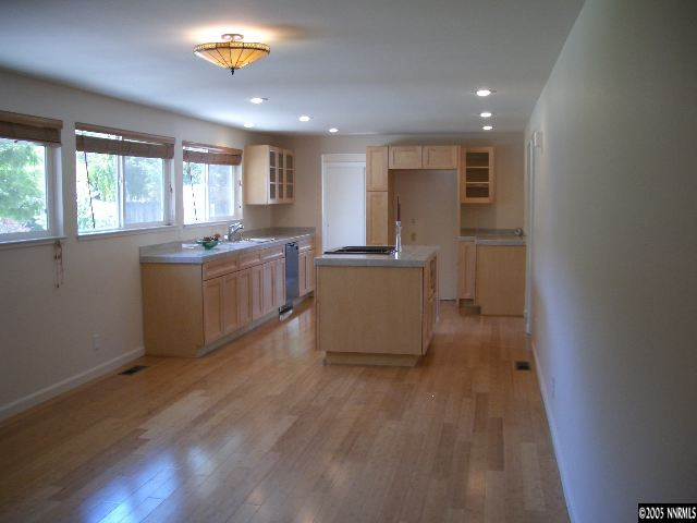 13905 Chamy Drive Reno, NV 89521 - Photo 2 of 9 a kitchen with a sink and wooden floor