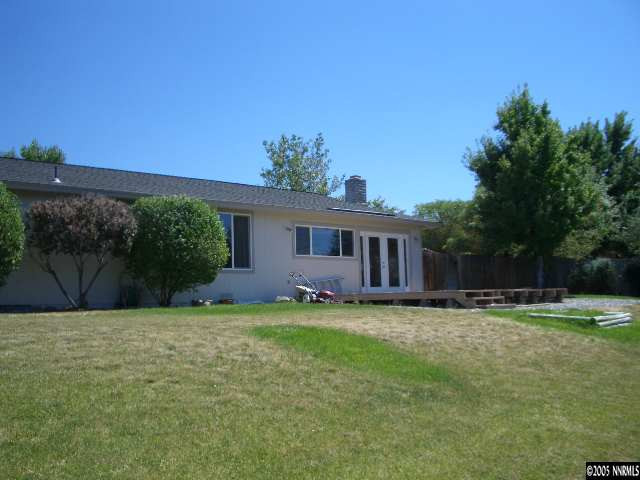 13905 Chamy Drive Reno, NV 89521 - Photo 8 of 9 a front view of a house with a yard