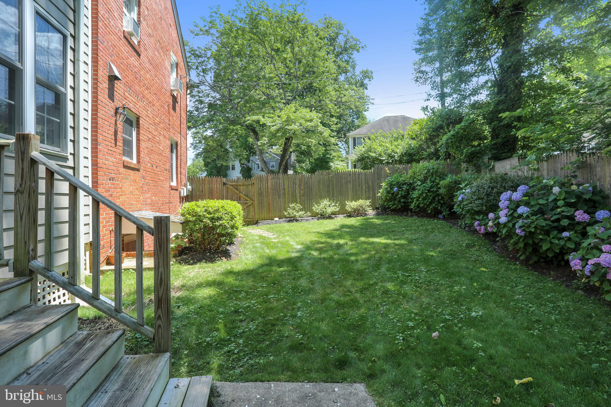 8636 Melwood Road Bethesda, MD 20817 - Photo 32 of 36 Fenced Backyard w Mature Landscaping