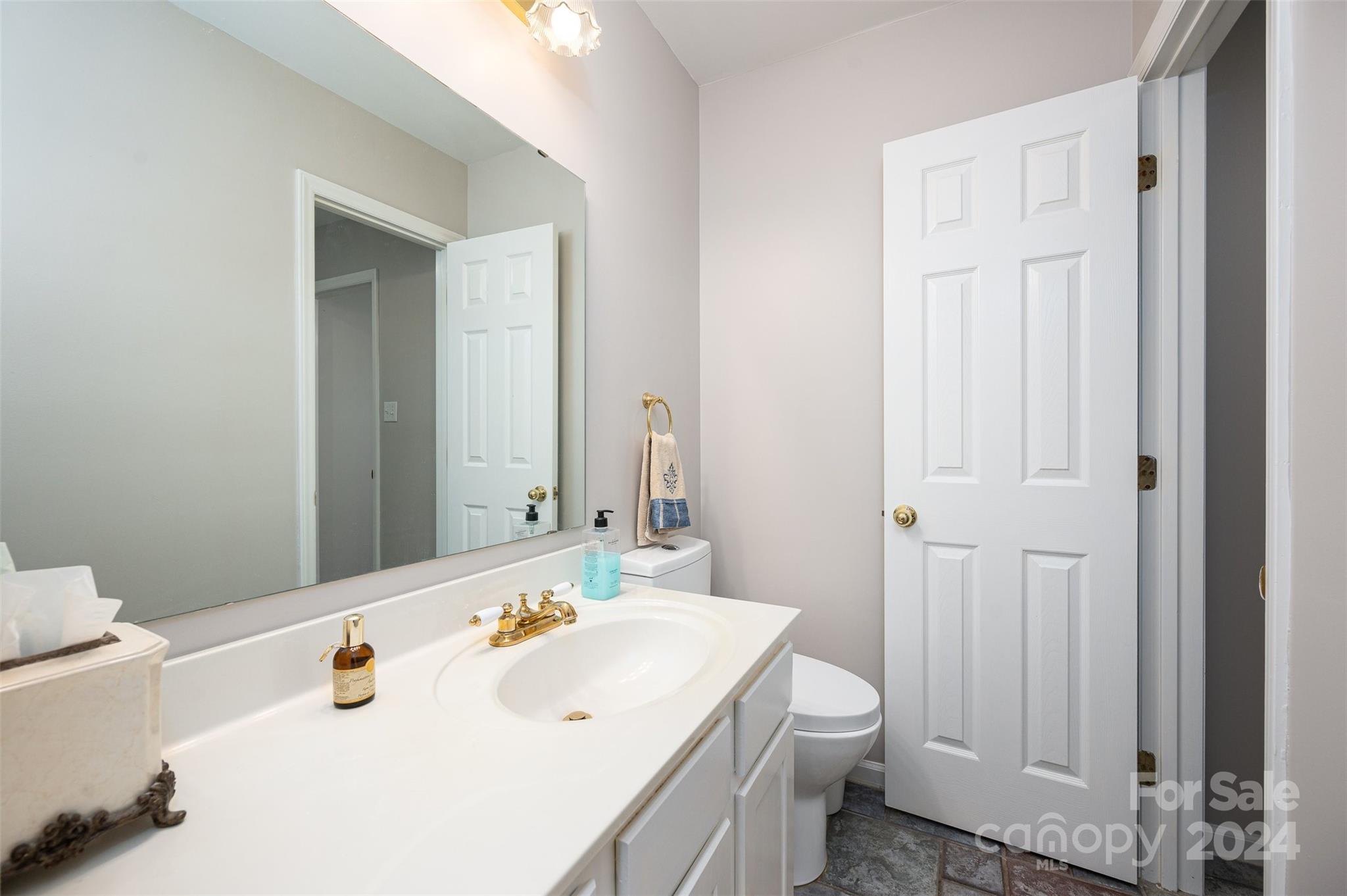 2009 Union Road, Unit E Gastonia, NC 28054 - Photo 11 of 17 a bathroom with a sink a toilet and shower