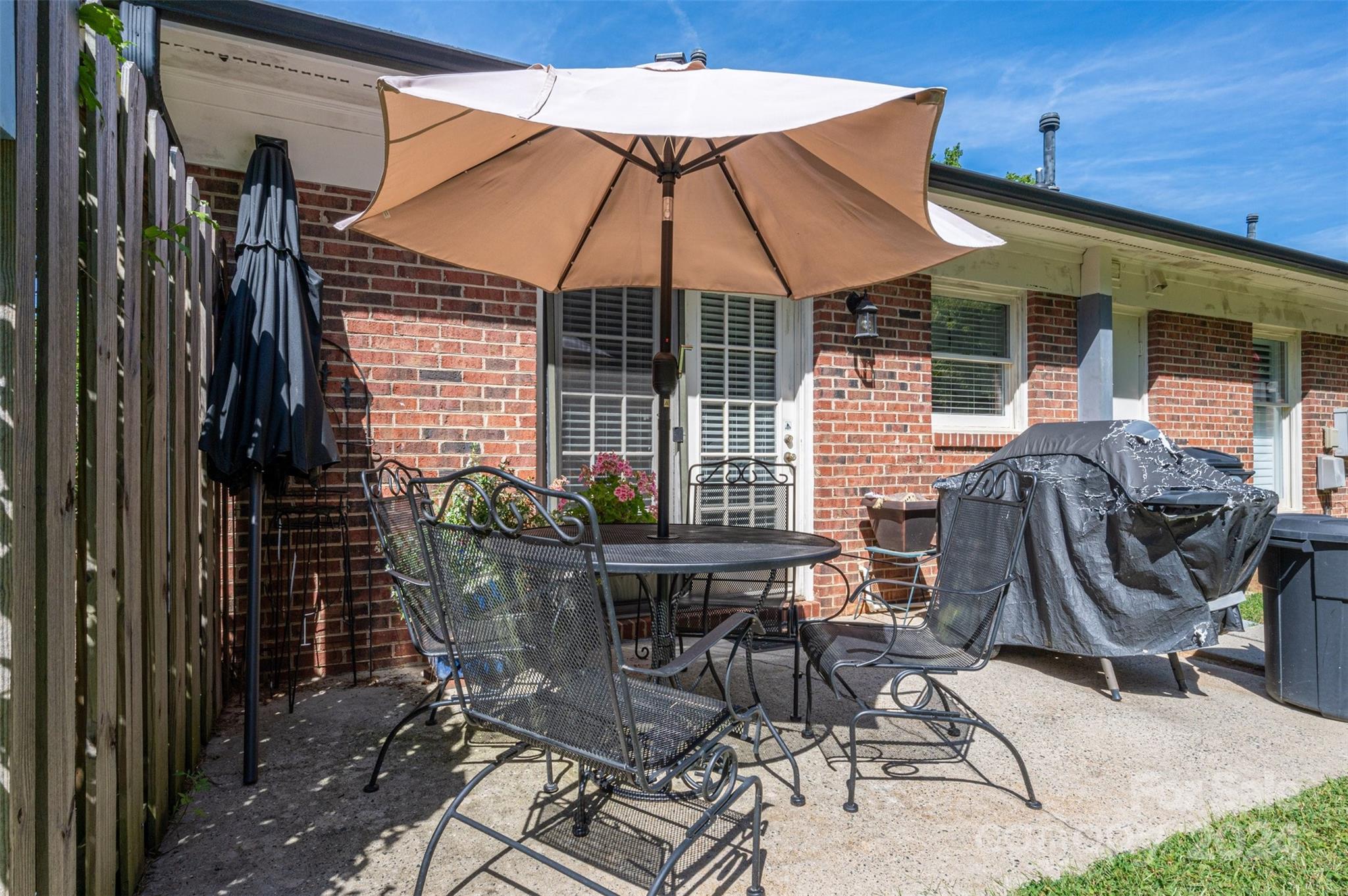 2009 Union Road, Unit E Gastonia, NC 28054 - Photo 14 of 17 a view of dinning table and chairs in patio