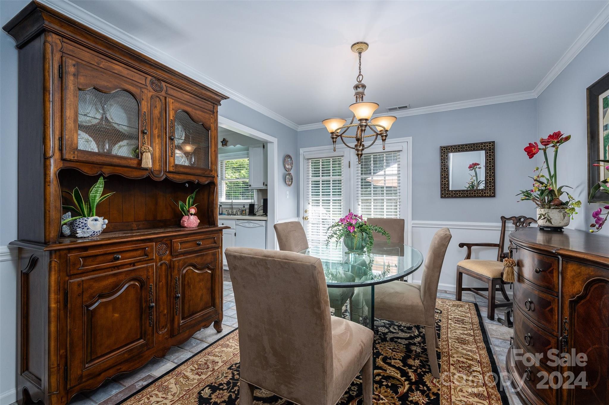 2009 Union Road, Unit E Gastonia, NC 28054 - Photo 7 of 17 a dining room with furniture a chandelier and wooden floor
