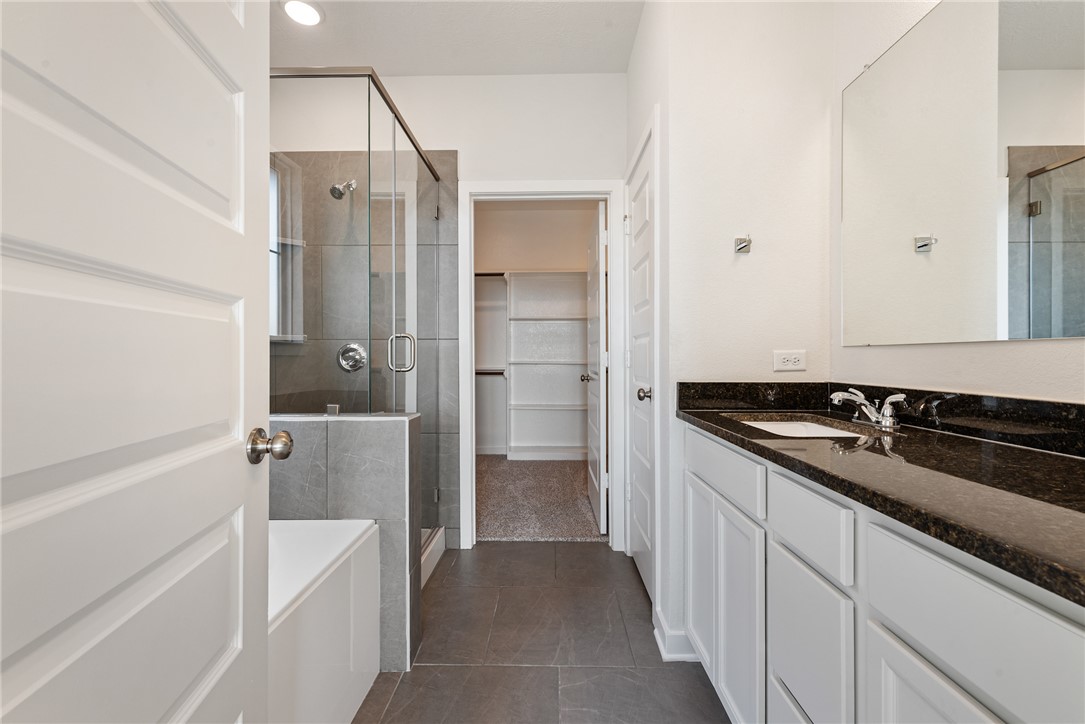 2415 Rooke Road Bryan, TX 77807 - Photo 28 of 36 a bathroom with a sink and a mirror