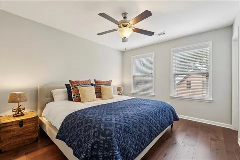 a bedroom with bed and window