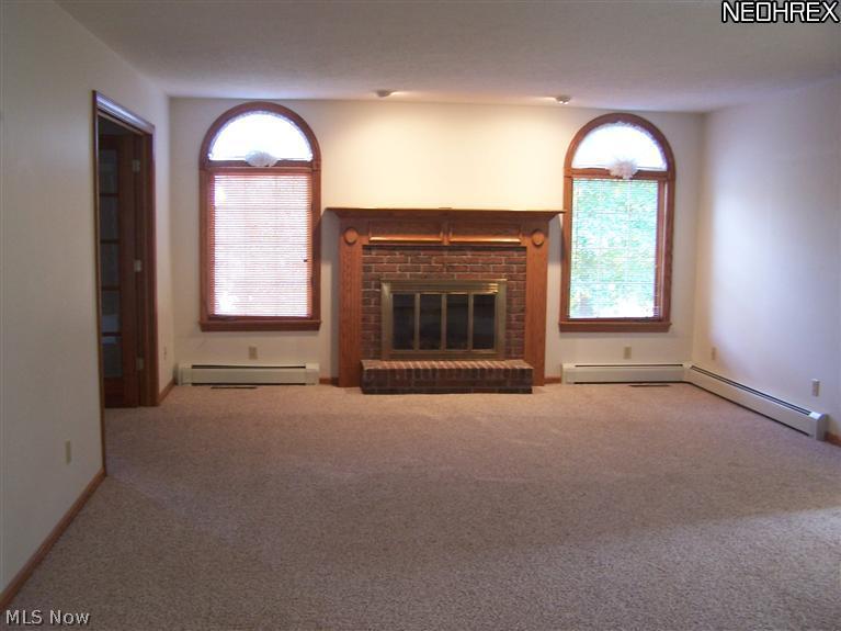 3026 Falcons Ridge Circle Northwest Canton, OH 44708 - Photo 5 of 20 Gas fireplace in this spacious great/family room. Newly carpeted