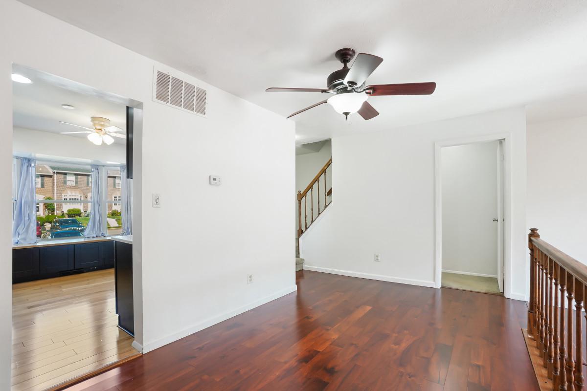 35 Bellfalls Way Nottingham, MD 21236 - Photo 9 of 30 a view of empty room with wooden floor and fan