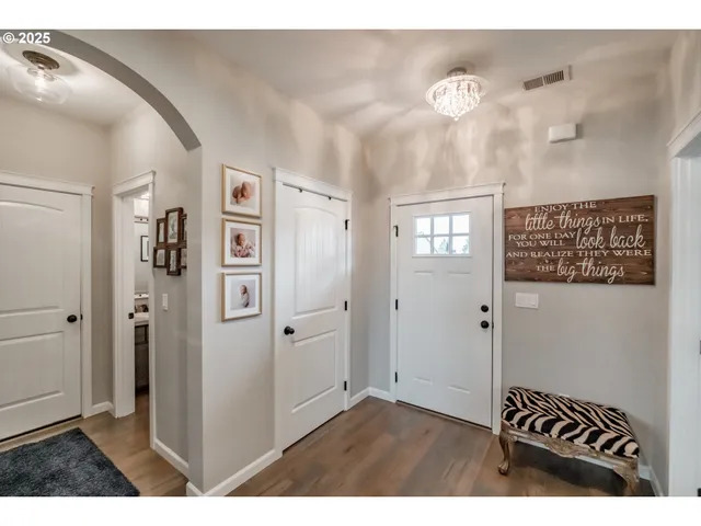 a bedroom with furniture and a window