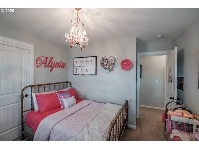 a bathroom with a sink vanity mirror and toilet