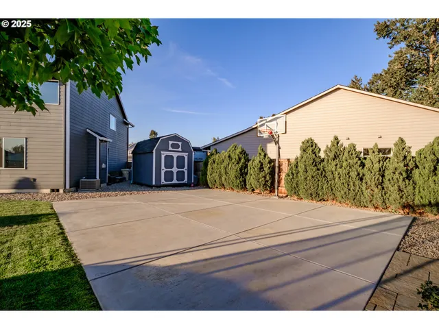 a view of a backyard with sitting area