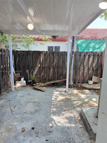 a white toilet and tub sitting next to a bathroom sink