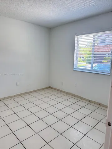 a bathroom with a sink a toilet a mirror and vanity