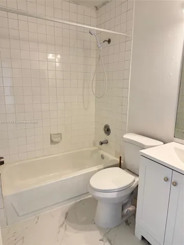 a view of a livingroom and entryway