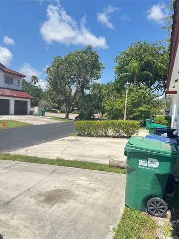 a view of a yard and front view of a house