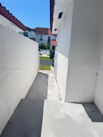 a kitchen with a stove a sink and a microwave