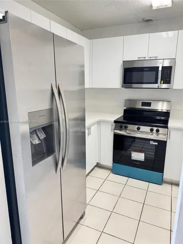 a bathroom with a shower and a mirror