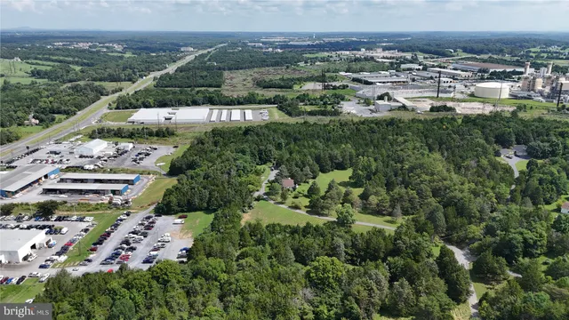 an aerial view of a house with lots of trees