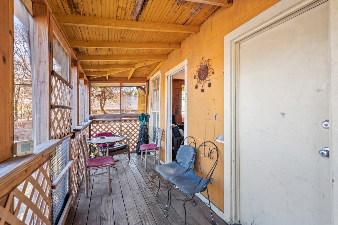 1001 Catalpa Street Austin, TX 78702 - Photo 4 of 10 a balcony with wooden floor table and chairs