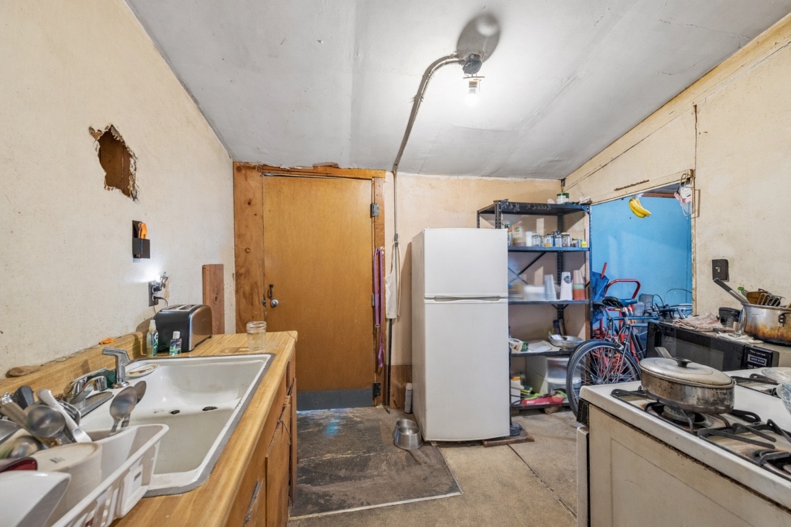 1001 Catalpa Street Austin, TX 78702 - Photo 9 of 10 a room with storage and utility