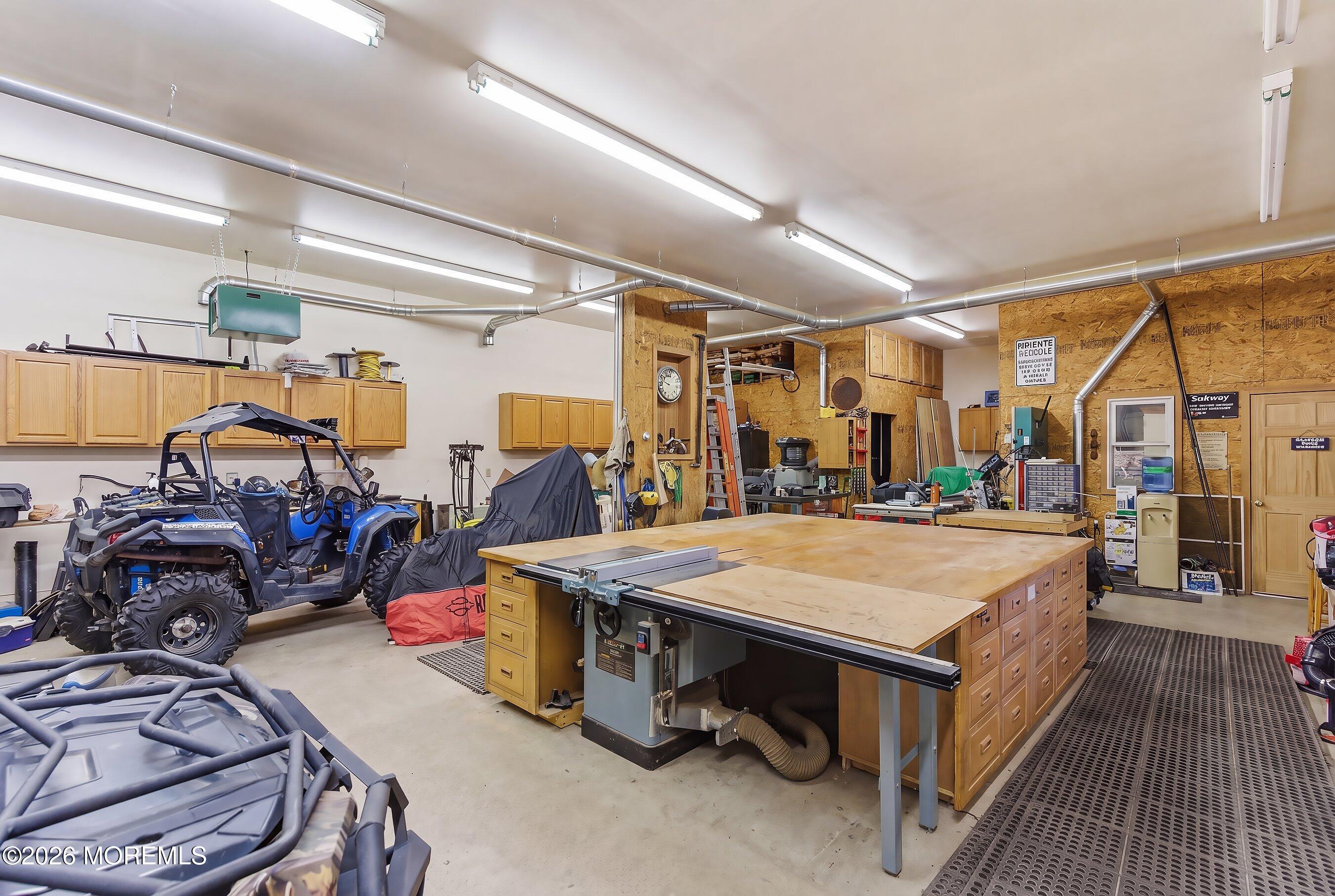 745 Oak Glen Road Howell, NJ 07731 - Photo 30 of 46 a room with gym equipment and a table