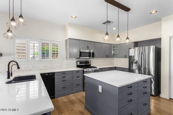 a kitchen that has a lot of cabinets in it