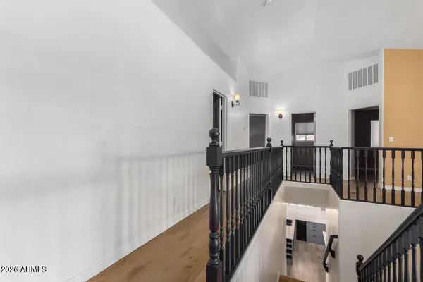 a bathroom with a granite countertop sink a mirror and a toilet