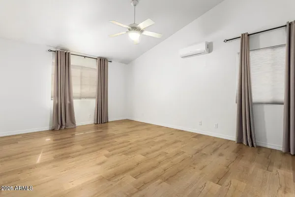 a large kitchen with granite countertop a sink and a stove