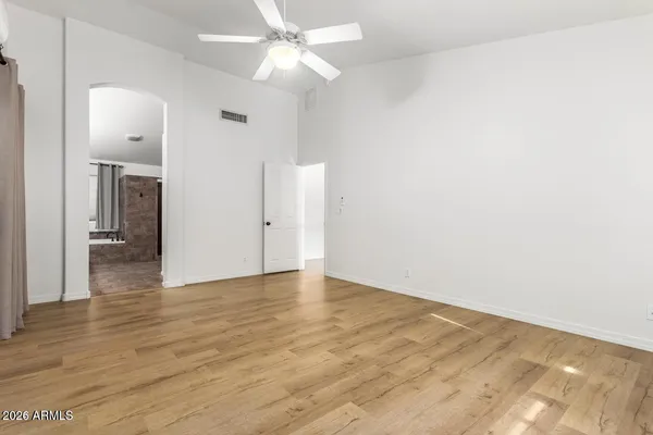 a bathroom with a shower and a sink