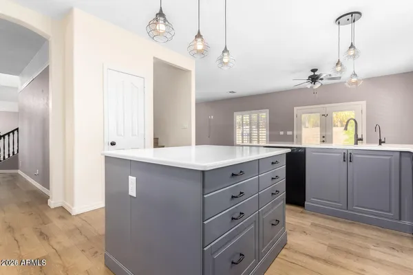 a kitchen with granite countertop a stove and a sink