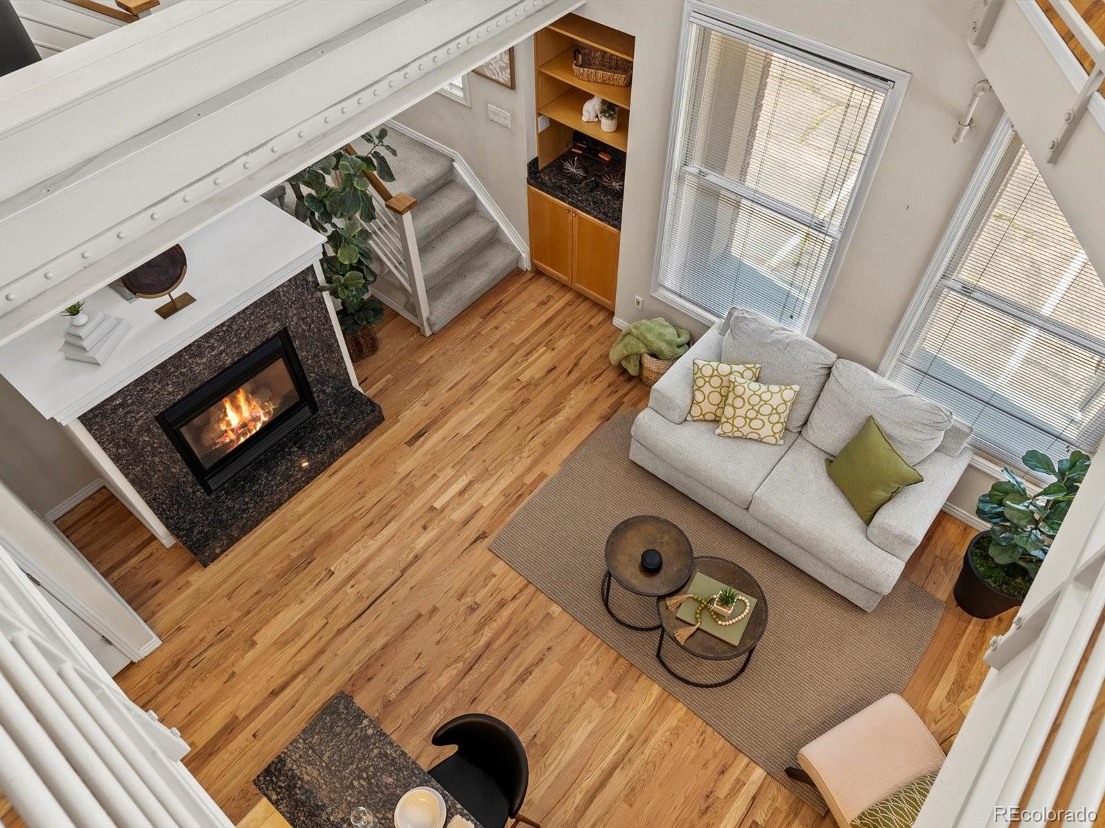 225 Lincoln Street, Unit 4 Denver, CO 80203 - Photo 17 of 34 a living room with furniture and a fireplace