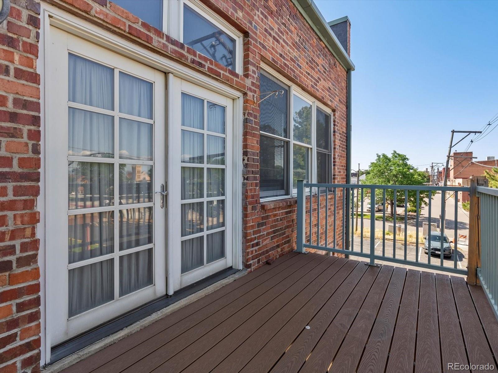 225 Lincoln Street, Unit 4 Denver, CO 80203 - Photo 22 of 34 a view of wooden balcony with wooden floor