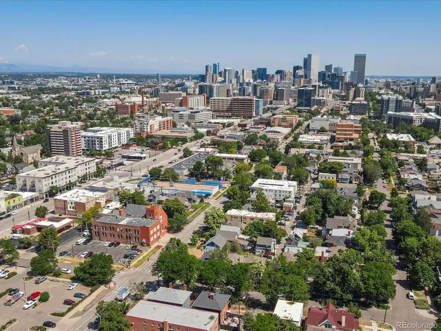 an aerial view of a city with lots of residential buildings