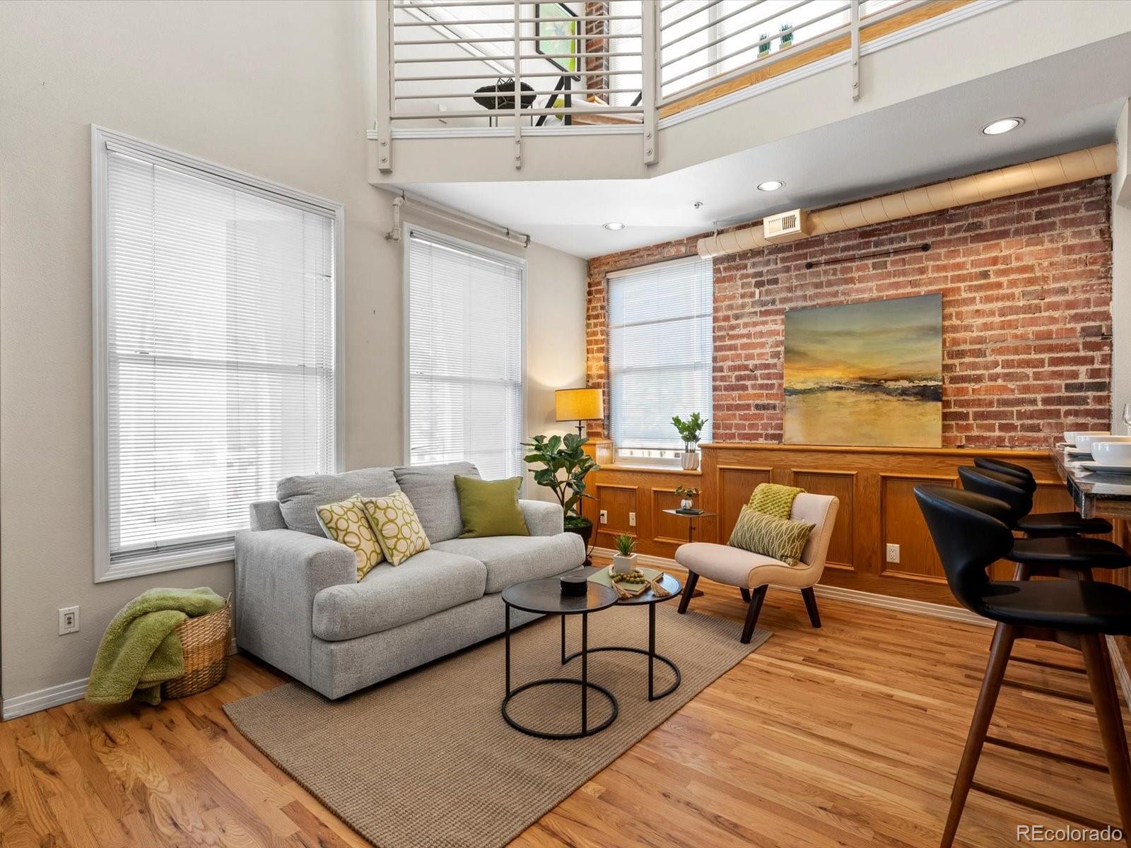 225 Lincoln Street, Unit 4 Denver, CO 80203 - Photo 6 of 34 a living room with furniture and a window
