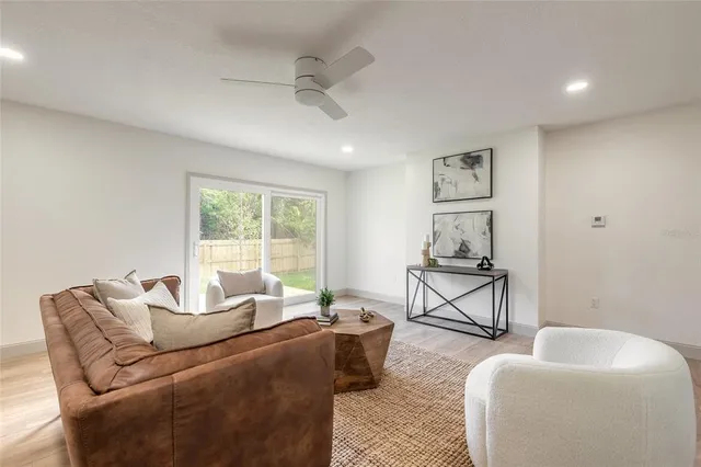 a living room with furniture and a window