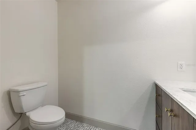a dining room with furniture a chandelier and wooden floor