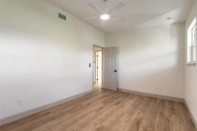 a bathroom with a sink a toilet a mirror a bathtub and shower