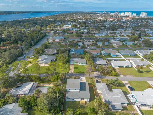 an aerial view of residential houses with outdoor space