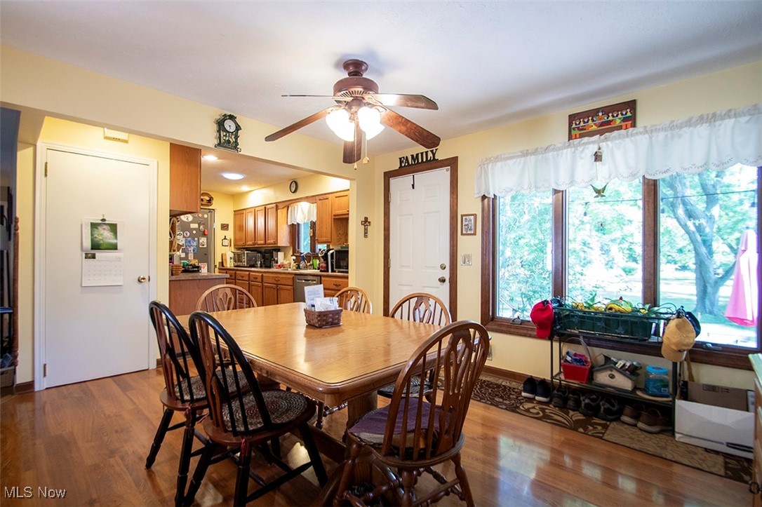 20749 Albion Road Strongsville, OH 44149 - Photo 10 of 35 Dining room with baseboards, ceiling fan, and wood finished floors