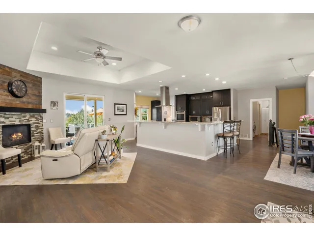 a living room with furniture and fireplace