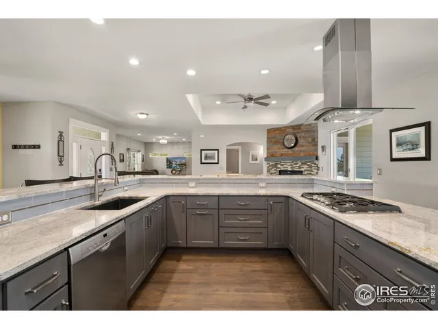 a kitchen with sink stove and cabinets