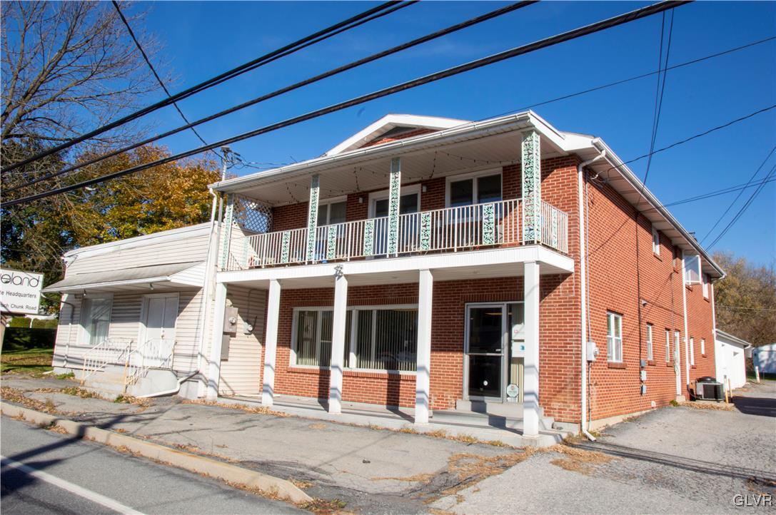 a front view of a house with a outdoor space