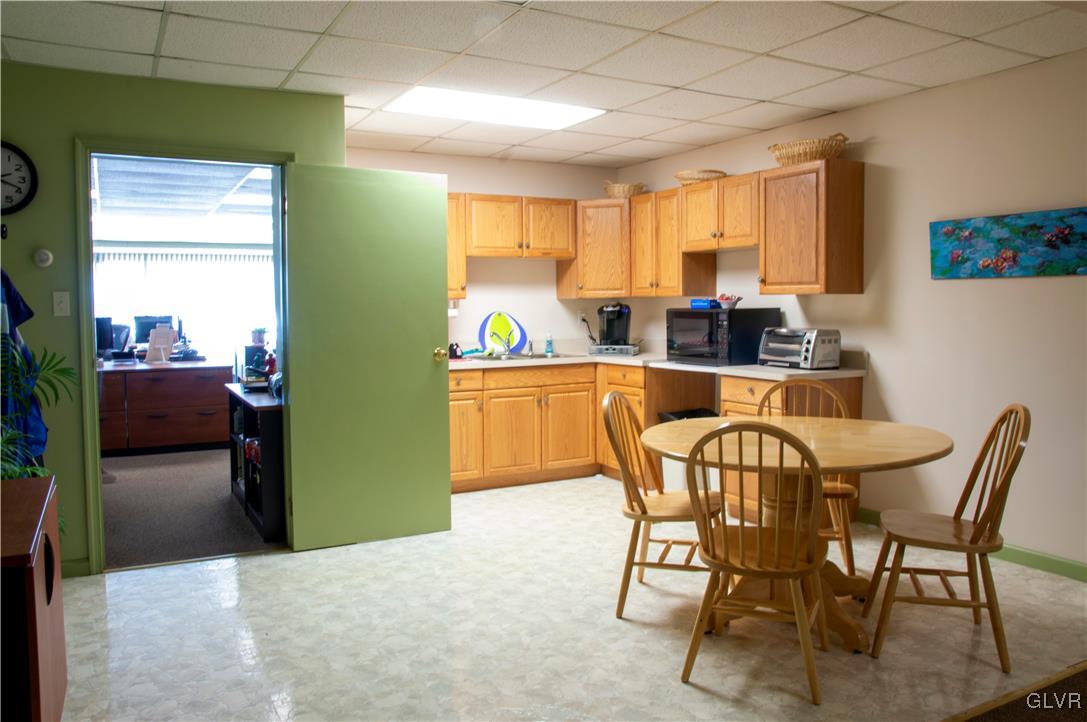 4111 Mauch Chunk Road Coplay, PA 18037 - Photo 26 of 43 a view of a dining room with furniture and a window