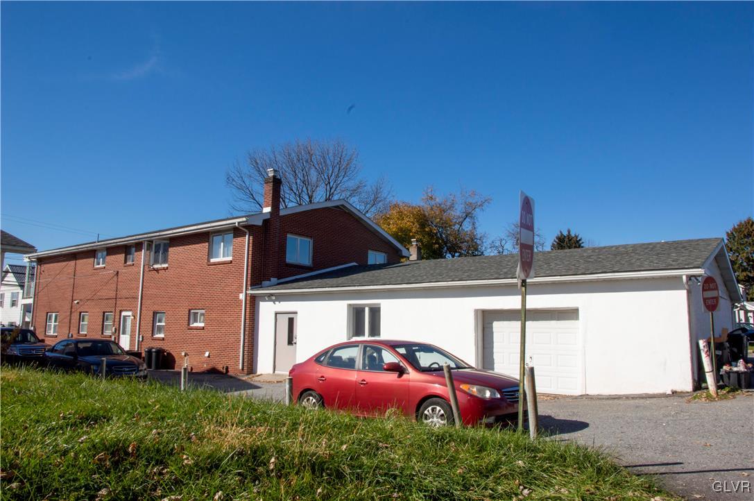 4111 Mauch Chunk Road Coplay, PA 18037 - Photo 7 of 43 a front view of a house with a garden