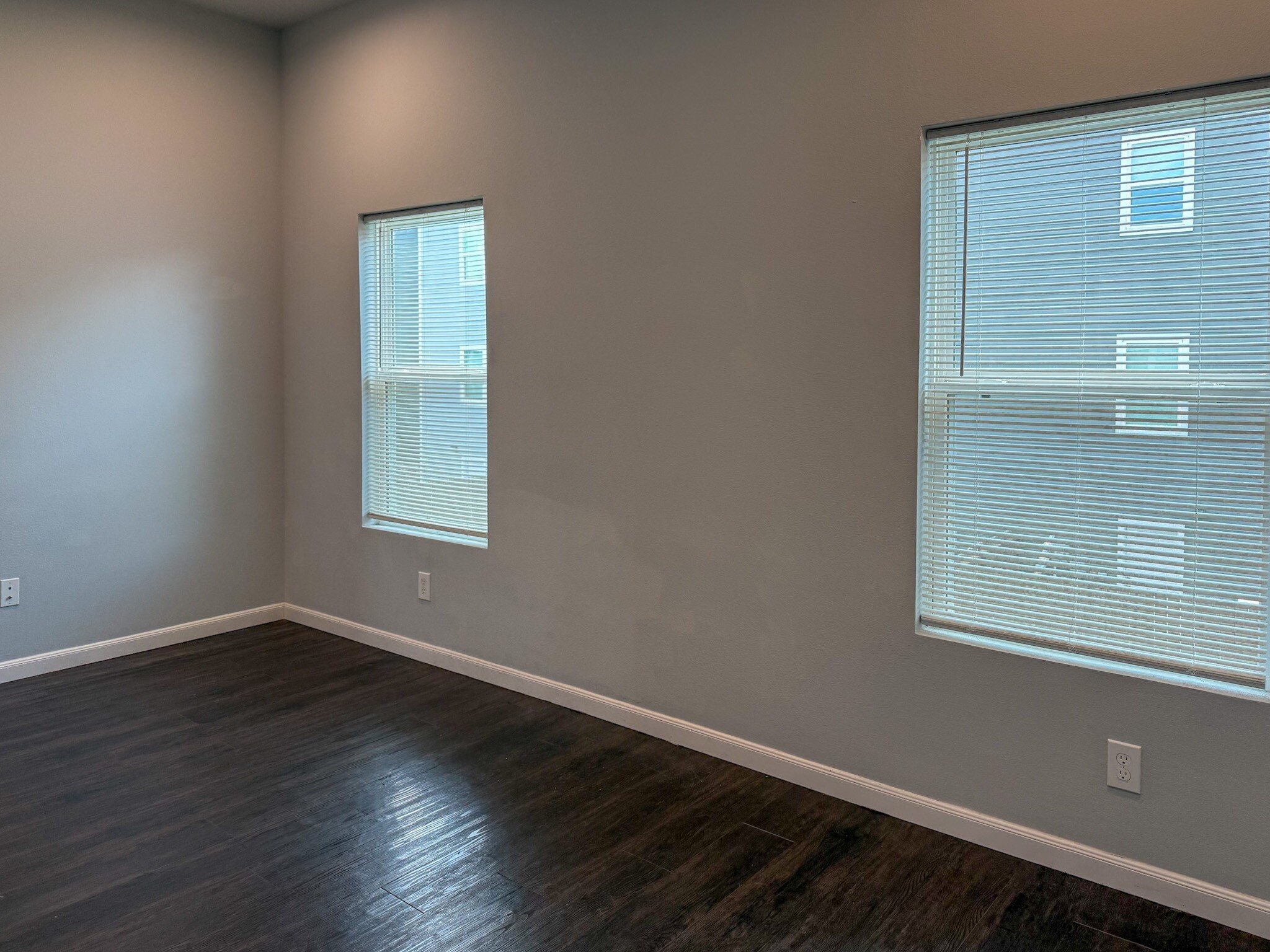 4939 Ambient Dr Spring Spring, TX 77379 - Photo 12 of 18 an empty room with wooden floor and windows