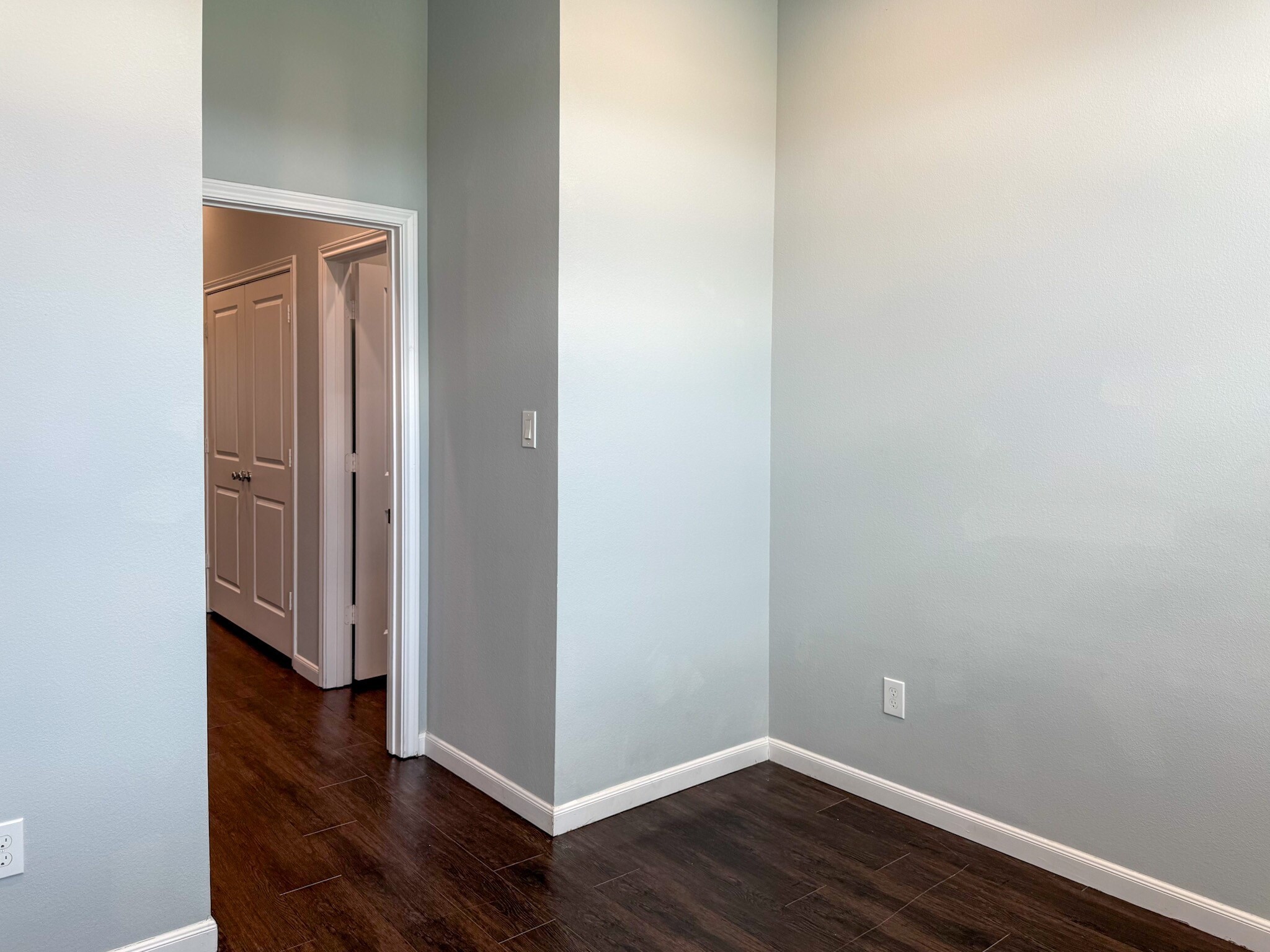 4939 Ambient Dr Spring Spring, TX 77379 - Photo 17 of 18 a view of an empty room with wooden floor