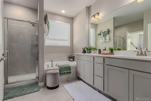 a bathroom with a tub and a window